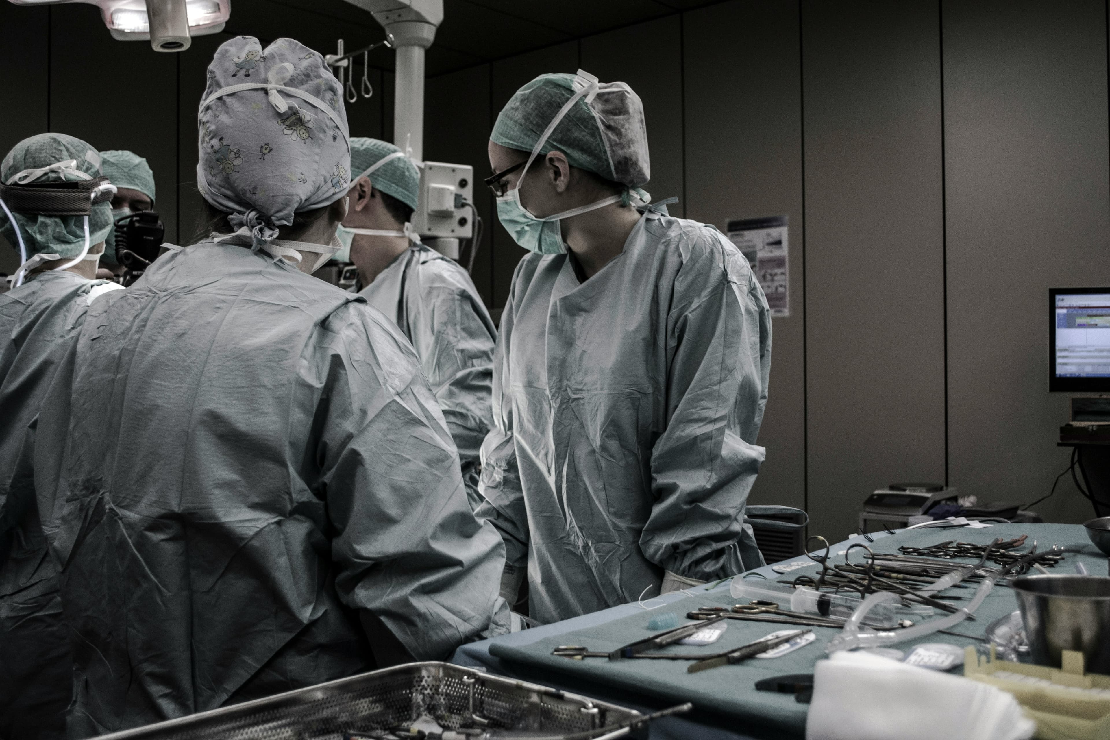 Biomedical engineering team servicing surgical equipment